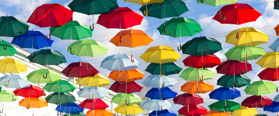 Installation of hanging colored umbrellas