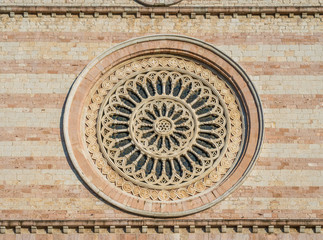 Rose window from the Basilica of Santa Chiara in Assisi, Umbria, central Italy.