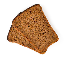 Two pieces of rye bread on a white. The view from the top.