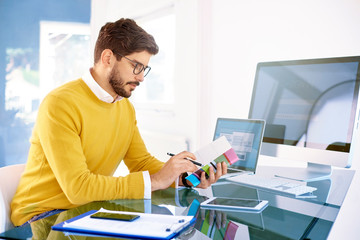 Businessman sitting at office desk and working