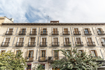 Facade of a large classical building, typical of the center of Madrid