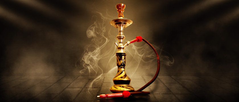 Hookah on a dark abstract background, smoke, fog, neon, concrete, rays