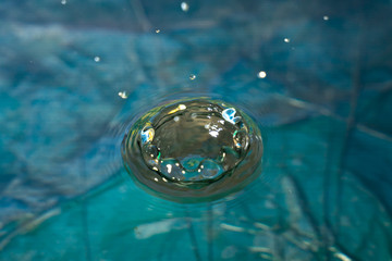 Splash of blue clear water splash, closeup