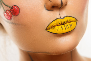 Female lips with creative pop art makeup