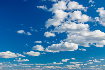 Blue sky with white clouds on sunny day as background