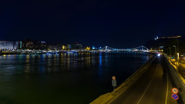 Night Time Lapse Scene of traffic at the Danube river in Budapest with view on Elizabeth bridge and part of the street traffic. Filmed from Chain Bridge. 4K Time Lapse scene. Budapest skyline.