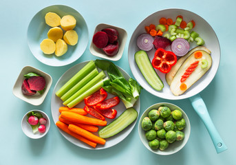fresh healthy vegetables on a blue pastel background