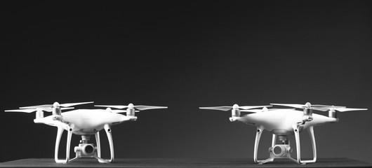 Flying drones on black background. Theme selling and buying drone