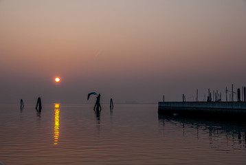 Naklejka na ściany i meble Italy. Sunset in the lagoon of Venice
