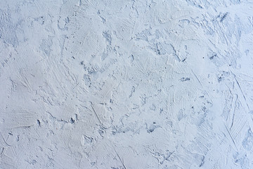 fragment of gray cement wall with irregularities
