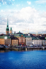 Fototapeta premium old town waterfront and ships of Stockholm with snow, Sweden
