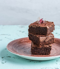 stack of square pieces of baked brownies