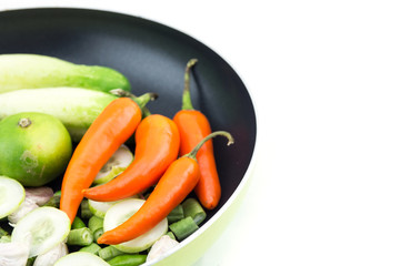 orange, mini sweet peppers in pan