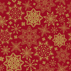 Vector seamless pattern with snowflakes. Winter background. Christmas and New Year's ornament. Golden laced snowflakes on red