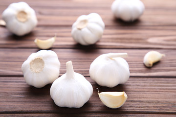 Fresh garlic on a brown wooden background