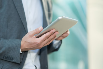 Businessman using his tablet
