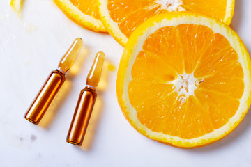 Vitamin C, natural anti aging cosmetics ampulas concept