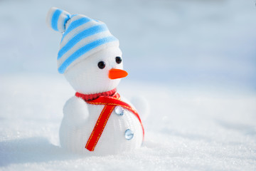 Snowman in the snow. Winter time scene.