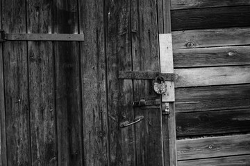 Old wooden door with barn lock