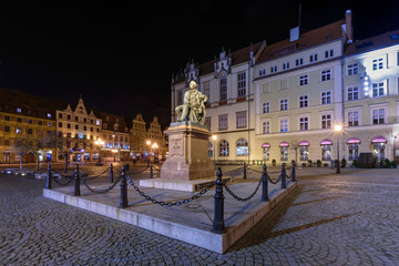 The monument of Aleksander Fredro in front of the town hall. - obrazy, fototapety, plakaty