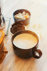 fresh breakfast with hot coffee in morning sunlight