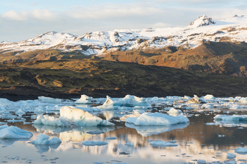 view of the ice pieces floating on the lake, glacier in the background, Iceland