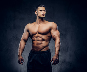 Fototapeta na wymiar A handsome power athletic man with the muscular body