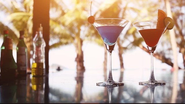 cocktail drinks in beach bar near swimming pool in luxury hotel