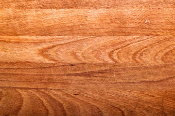 Used scraped kitchen board. Wood layers forming the surface of a kitchen board.