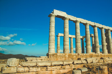 The Temple of Poseidon and a tree. Cape Sounion, Greece