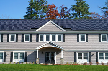 close up on apartment building with solar panel installed on the roof