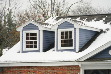 close up on ancient house attic with snow