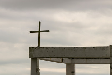 cross on the background of blue sky and clouds