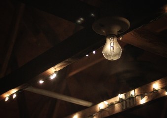 Light bulb in a wooden barn.