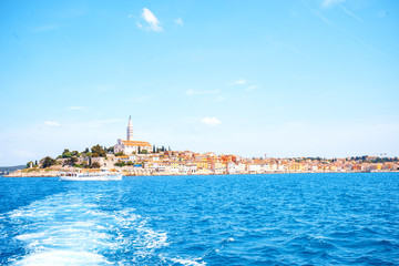Fototapeta na wymiar Romantic and colorful old town Rovinj during summer on a bright day with turquoise sea and blue sky. Istrian Peninsula, Croatia, Europe. Marina of an old Venetian town near the Adriatic sea, Rovinj