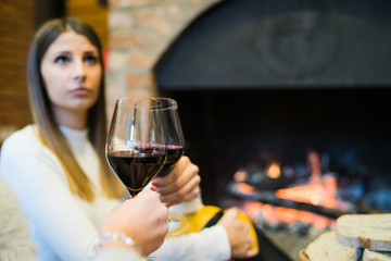 woman with a glass of red wine