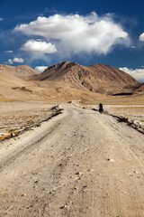 Pamir highway or Pamirskij trakt with biker, Tajikistan