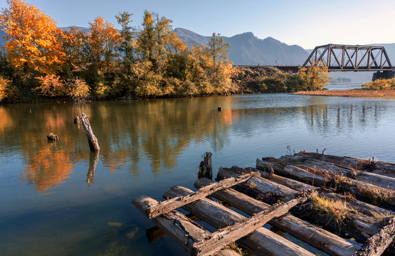 Wooden frame of the old pier in the fall in the bay of the Columbia River