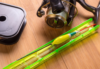 Fishing tackle on a wooden table © liga258