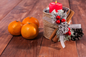 Mandarins and candles on the table