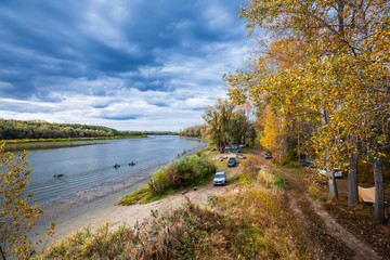 Cars vacationers on the river Ob. Suzun, Novosibirsk region, Western Siberia