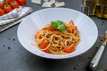 Spaghetti with vegetables in tomato sauce