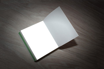 Open Notepad with white sheet of paper . Mocap Top view, close-up. Place for text. vignette