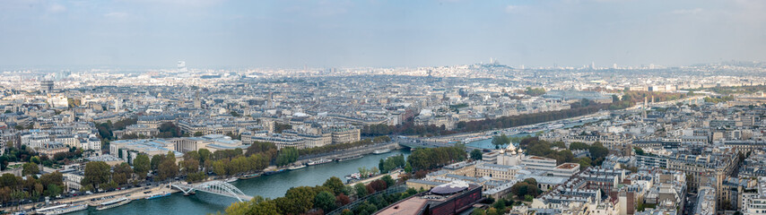 Fototapeta na wymiar Wide Panorama of Downtown PAris from the Eiffell Tower With the Church Hill in the Background