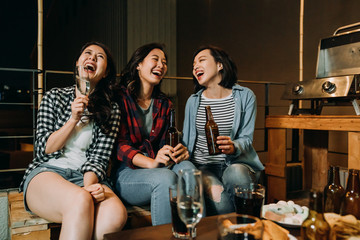 asian girls having fun chatting on barbecue party