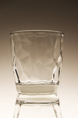 Small glass isolated on brown background