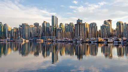 Skyline of Vancouver, BC, Canada from harbor at sunset