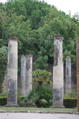 Fototapeta na wymiar Columns and ruins at Pompeii, Italy