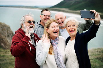 Group of happy seniors taking a selfie