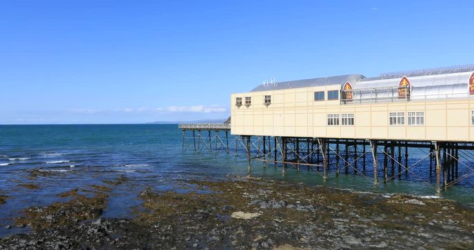 Irish Sea Aberystwyth Wales pier pavilion. Ancient market town, administrative center, community, and holiday resort in Ceredigion, Wales. Tourist destination for beach, historic train, castles.